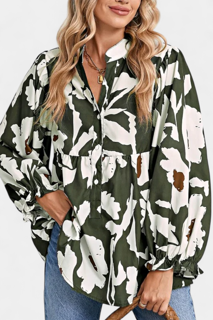 Blusa Filomena con mangas abullonadas y medio botón con estampado floral abstracto