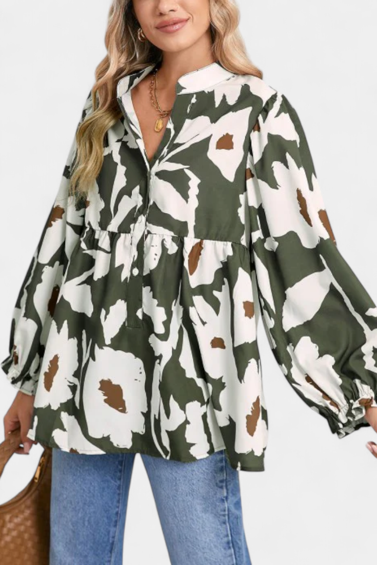 Blusa Filomena con mangas abullonadas y medio botón con estampado floral abstracto